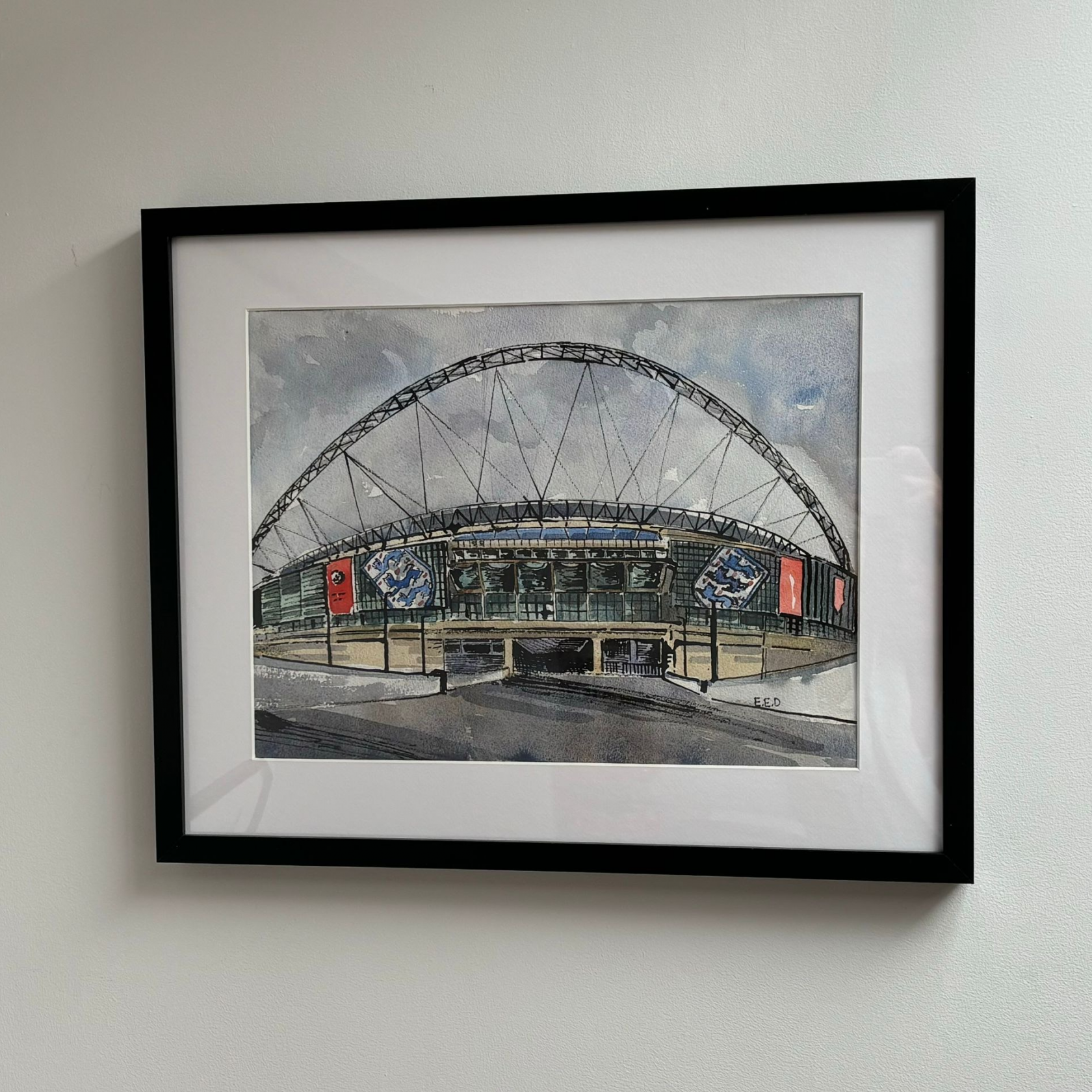 An original hand painted and framed watercolour of Wembley Stadium from E E Daniels